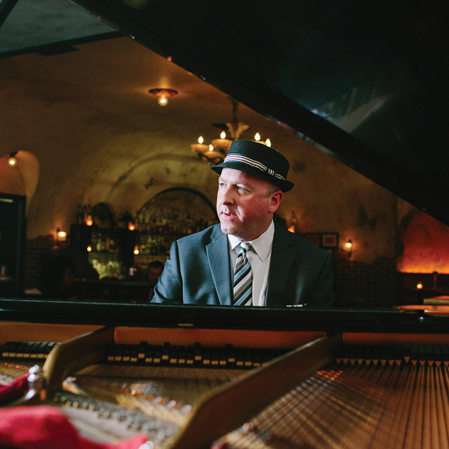 Photo of Rick Germanson through the grand piano