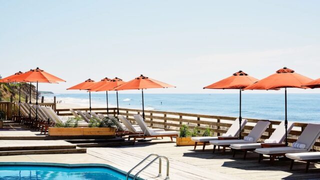A view of the pool and deckchairs at Marram Montauk, a boutique beachfront hotel with ocean views