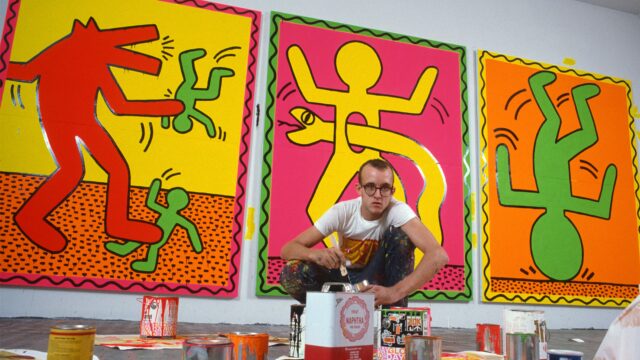 Artist Keith Haring at work in his studio making paintings for an upcoming art exhibit.