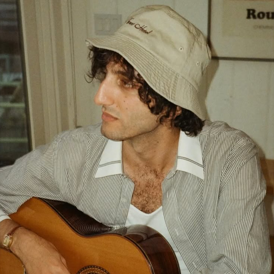 Andrew Kamel in a boat hat