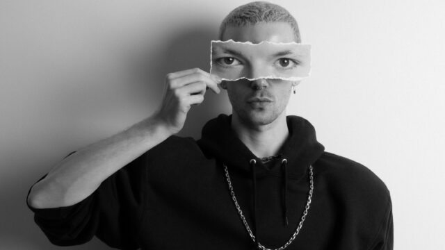 A black and white portrait of the New York-based designer Andrew Curwen.