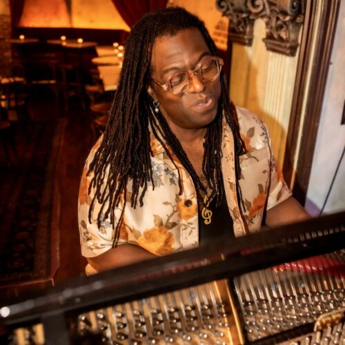 Darnell white at piano 500x500