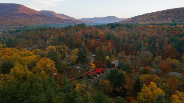 Aerial view of The Leeway surrounded by fall foliage in the Catskills.