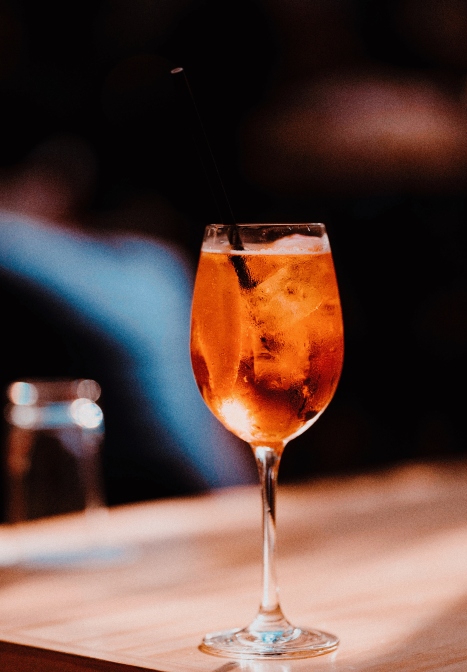 Aperol spritz cocktail on a table at Gilligan's outdoor bar and restaurant in SoHo, NY.