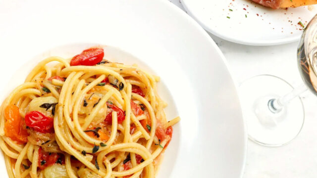 Pasta dish on white plate and table at Roxy Café in Tribeca.