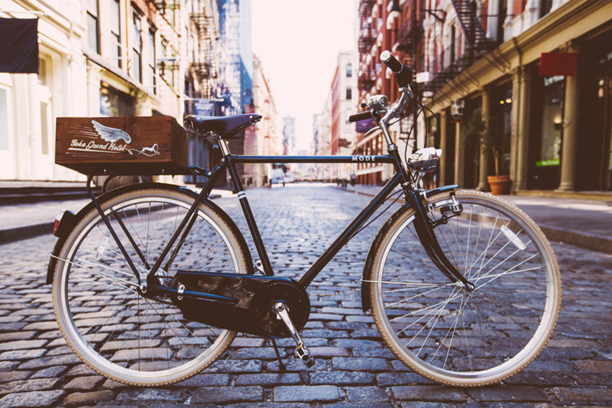 a Soho Grand branded bicycle is parked on the cobblestone streets of SoHo manhattan
