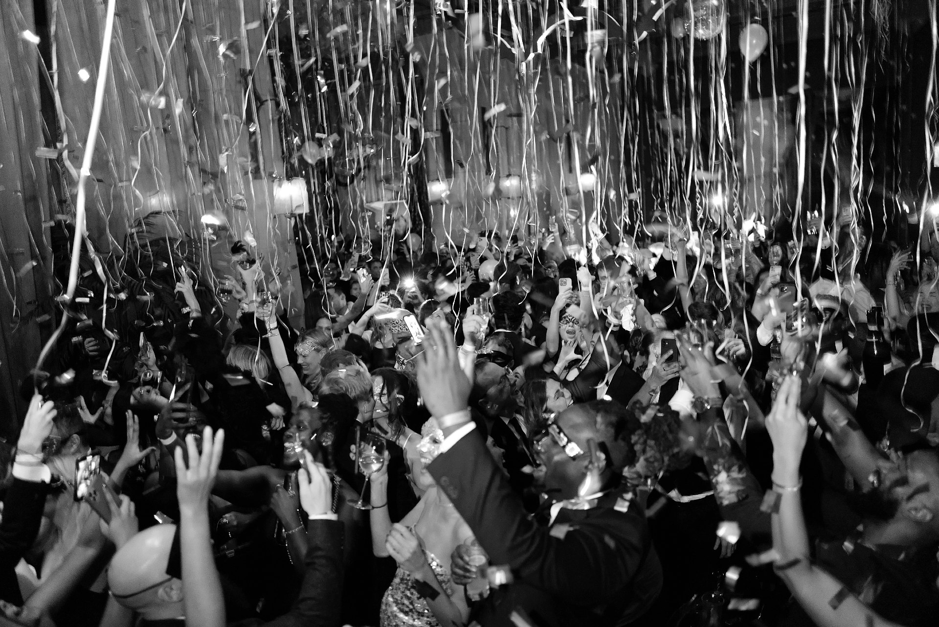 A crowd of people dancing during Soho Grand Hotel's New Year's Eve celebration.