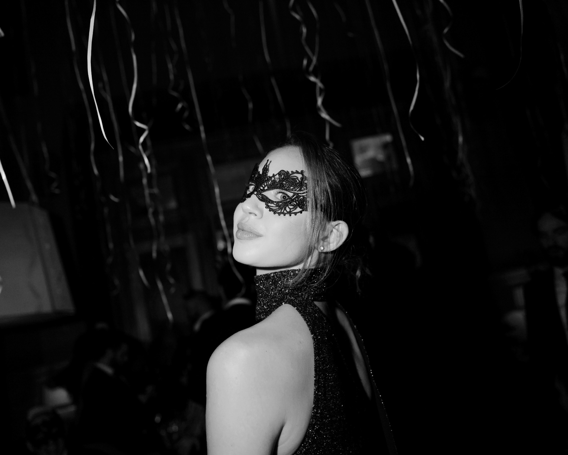 Woman wearing black mask at Soho Grand's New Year's Eve Masquerade Ball.