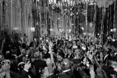 A crowd of people dancing during Soho Grand Hotel's New Year's Eve celebration.