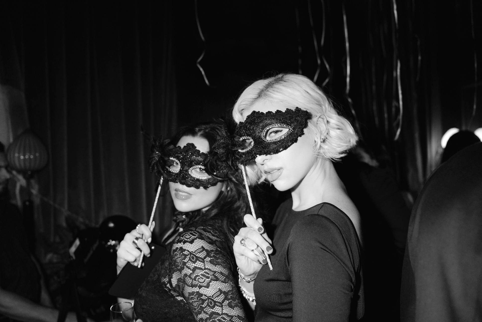 Woman wearing black mask at Soho Grand's New Year's Eve Masquerade Ball.