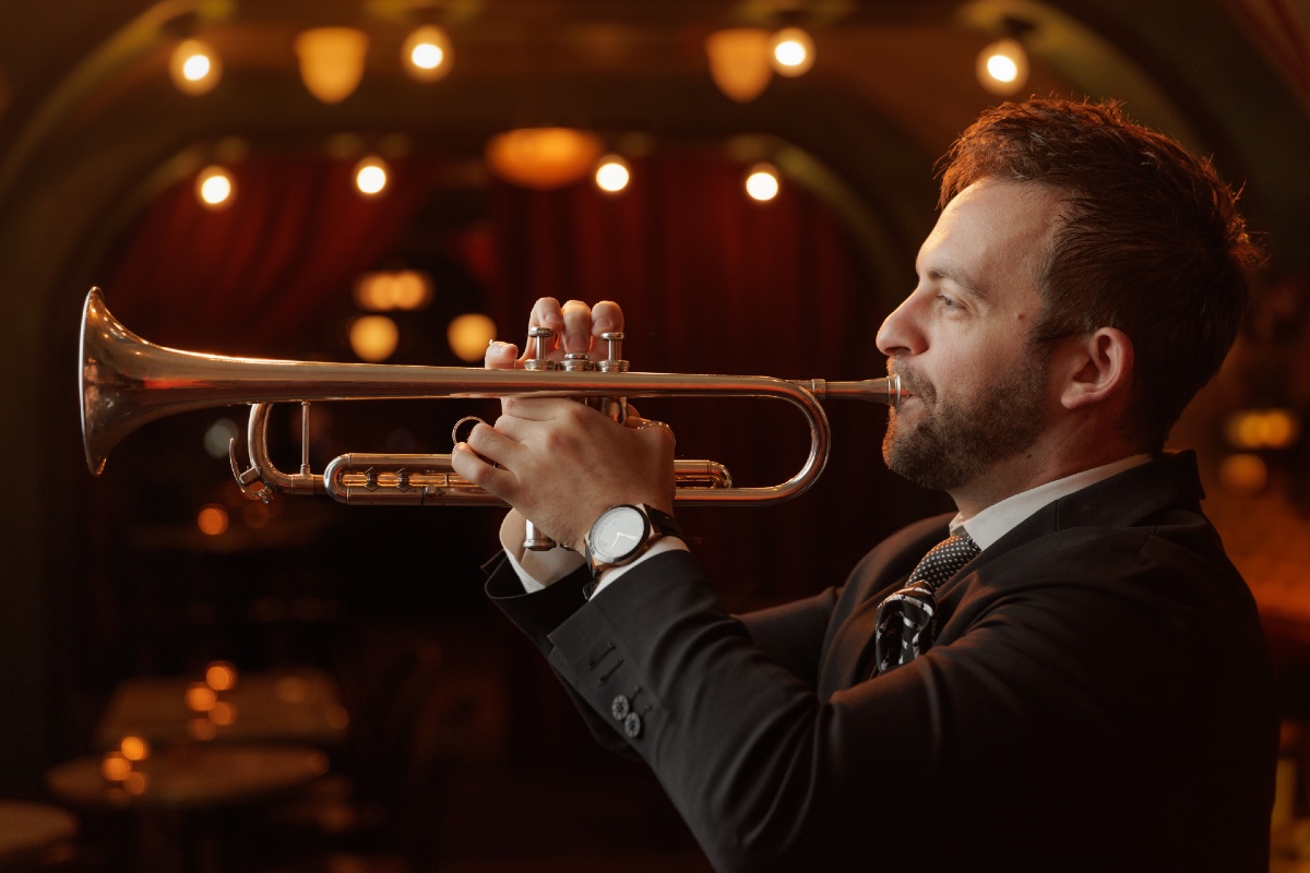 Musician Benny Benack III playing the trumpet at The Django Jazz Club and Restaurant