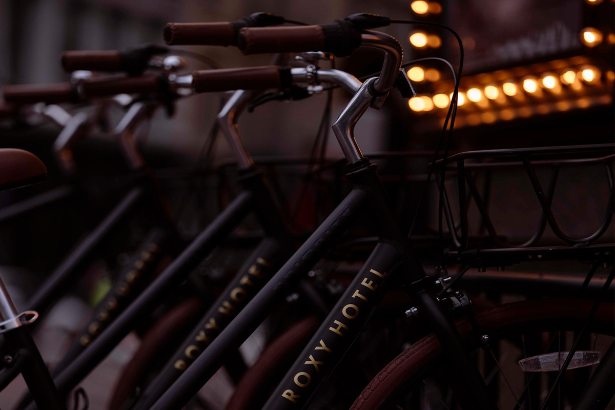 detail shot of roxy hotel branded bicycles lined up in a row