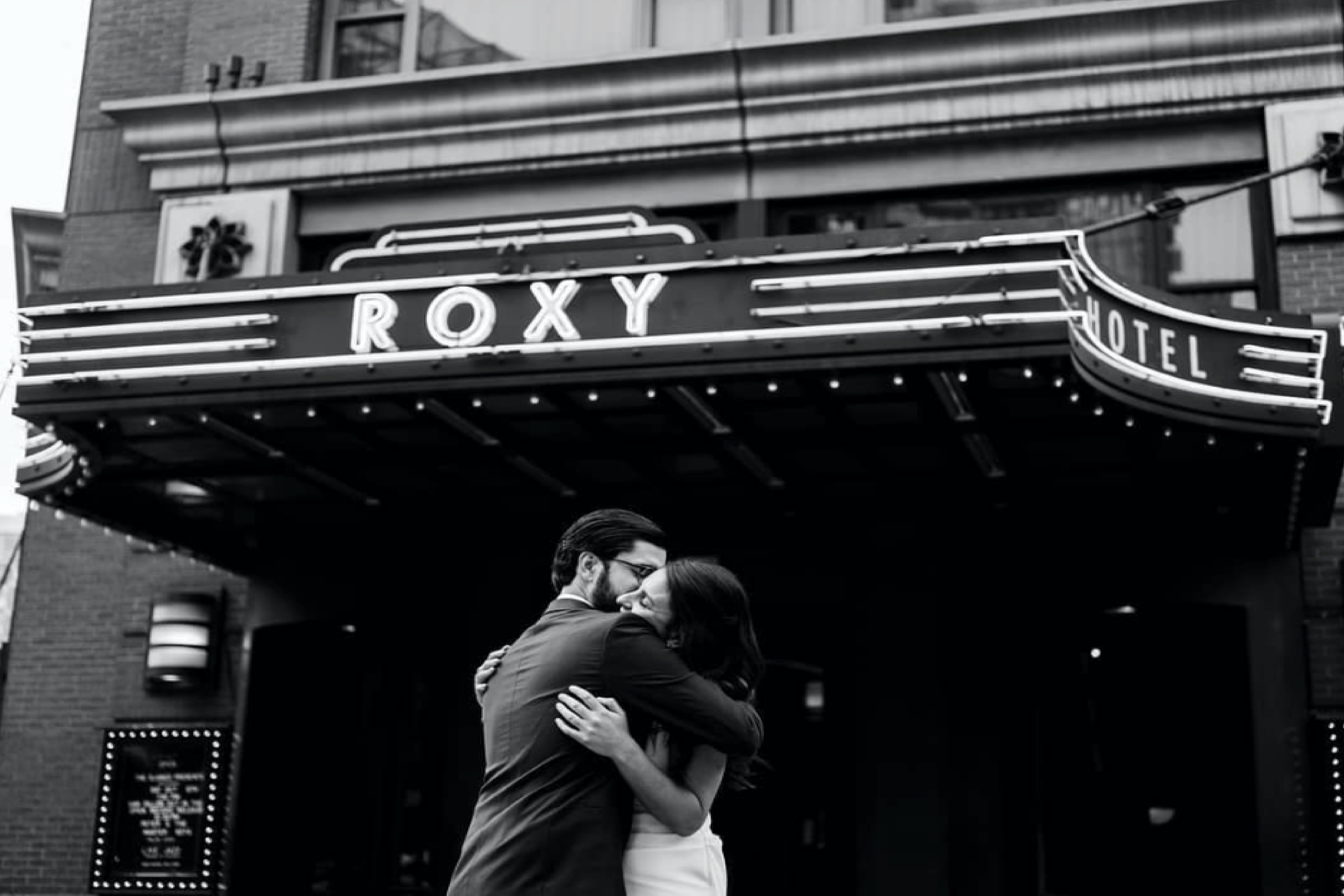Wedding couple under the Roxy Hotel marquee.