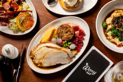 Thanksgiving Dinner entrees set on a table at Roxy Bar in Roxy Hotel.