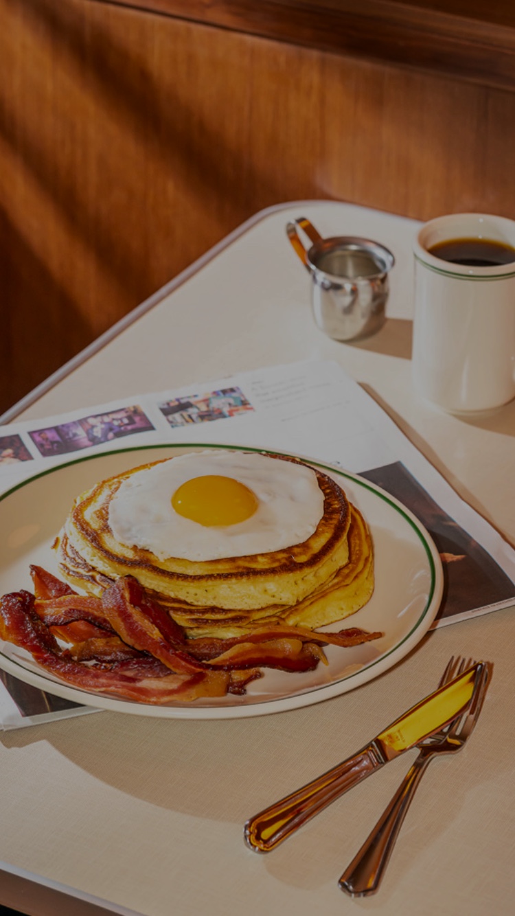 Pancakes with eggs and bacon at Soho Diner.