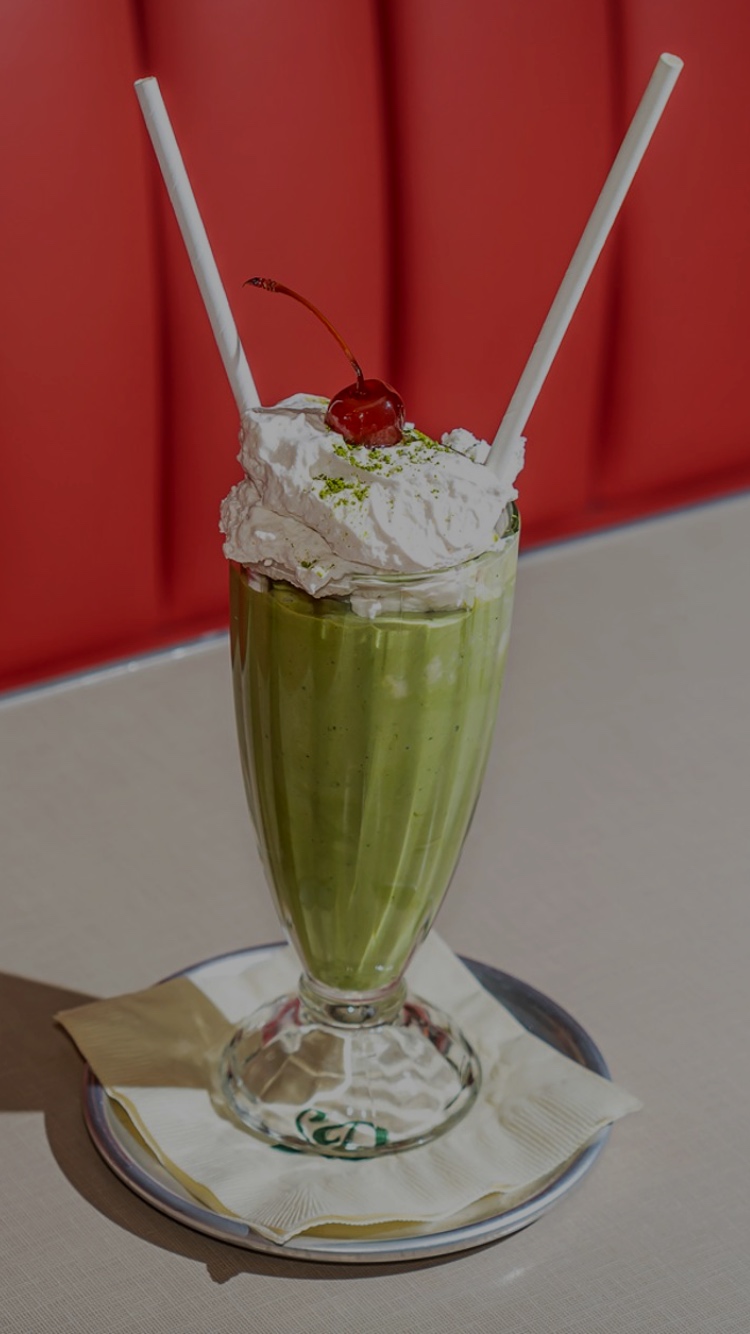 Vegan Matcha Milkshake with two straws at Soho Diner.