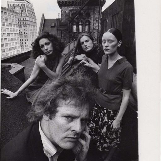 Vintage picture of a group of people on a NYC rooftop.