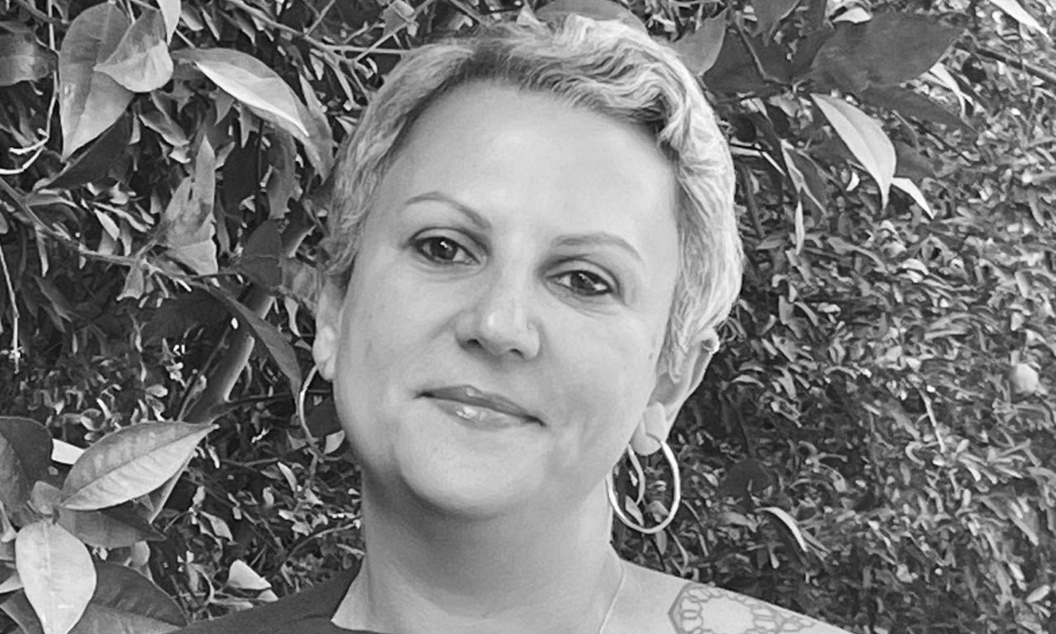 headshot of Dina Ramadan