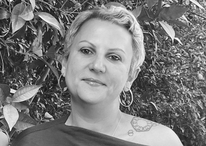 headshot of Dina Ramadan